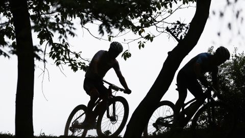 IZU, JAPAN - JULY 26: (L-R) Detailed view in shadow of Jofre Cullell Estape of Team Spain and Jens Schuermans of Team Belgium ride during the Men's Cross-country race on day three of the Tokyo 2020 Olympic Games at Izu Mountain Bike Course on July 26, 2021 in Izu, Shizuoka, Japan. (Photo by Tim de Waele/Getty Images)
