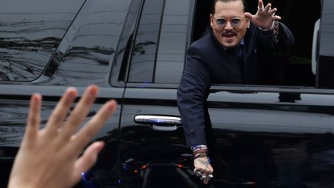 FAIRFAX, VIRGINIA - MAY 27: Actor Johnny Depp waves to supporters from his vehicle as he leaves a Fairfax County Courthouse May 27, 2022 in Fairfax, Virginia. Jury has started deliberation in the Depp v. Heard defamation trial, brought by Johnny Depp against his ex-wife Amber Heard. (Photo by Alex Wong/Getty Images)