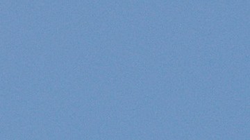 FORT MYERS BEACH, FLORIDA - SEPTEMBER 30: A Coast Guard helicopter flies a mission after Hurricane Ian passed through on September 30, 2022 in Fort Myers Beach, Florida. The hurricane brought high winds, storm surge and rain to the area causing severe damage. (Photo by Joe Raedle/Getty Images)