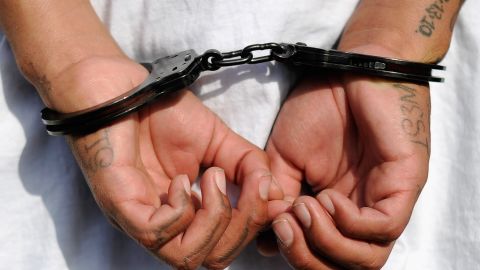 LOS ANGELES, CA - APRIL 29: Handcuffs are seen on the hands of a twenty-year old "Street Villains" gang member who was arrested by Los Angeles Police Department officers from the 77th Street division on April 29, 2012 in Los Angeles, California. The 77th Street division patrol the same neighborhood that truck driver Reginald Denny was nearly beaten to death by a group of black assailants at the intersection of Florence and Normandie Avenues. It’s been 20 years since the verdict was handed down in the Rodney King case that sparked infamous Los Angeles riots. (Photo by Kevork Djansezian/Getty Images)