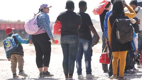 YUMA, ARIZONA - MAY 10: Immigrants seeking asylum in the U.S. await processing by Border Patrol after crossing into Arizona from Mexico on May 10, 2023 in Yuma, Arizona. A surge of immigrants is expected with the end of the U.S. government's Covid-era Title 42 policy, which for the past three years has allowed for the quick expulsion of irregular migrants entering the country. Over 29,000 immigrants are currently in the custody of U.S. Customs and Border Protection ahead of tomorrow's sunset of the policy. (Photo by Mario Tama/Getty Images)