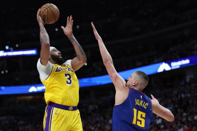 DENVER, COLORADO - MAY 16: Anthony Davis #3 of the Los Angeles Lakers shoots the ball over Nikola Jokic #15 of the Denver Nuggets during the second quarter in game one of the Western Conference Finals at Ball Arena on May 16, 2023 in Denver, Colorado. NOTE TO USER: User expressly acknowledges and agrees that, by downloading and or using this photograph, User is consenting to the terms and conditions of the Getty Images License Agreement. (Photo by Matthew Stockman/Getty Images)