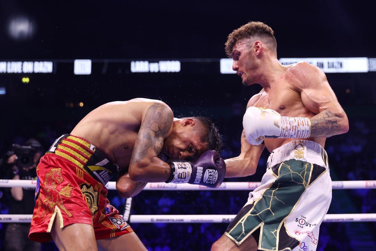 MANCHESTER, ENGLAND - MAY 27: Leigh Wood punches Mauricio Lara during their WBA World Featherweight Title Fight at AO Arena on May 27, 2023 in Manchester, England. (Photo by Nathan Stirk/Getty Images)