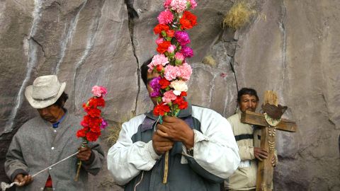 PUEBLA, MEXICO - MARCH 12: Residents of Xanxizintla and San Nicolas de los ranchos clean and prepare the crosses that will adorn the altar where they will leave the presents, fruit and tequila for Don Goyo March 12, 2003 in Puebla, Mexico. The Popocateptl volcano is affectionately known as Don Goyo, short for Gregory in Spanish, and the villagers believe that by placing offerings on this day they will keep the "smoking mountain" happy. (Photo by Susana Gonzalez/Getty Images)