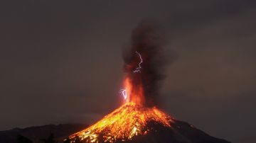 TOPSHOT - View from the Comala community, Colima State, Mexico, on January 19, 2017 of the Volcano of Fire in eruption. - The colima volcano is one of the most active in Mexico and in the last days its activity has intensified. (Photo by SERGIO VELASCO GARCIA / AFP) (Photo by SERGIO VELASCO GARCIA/AFP via Getty Images)