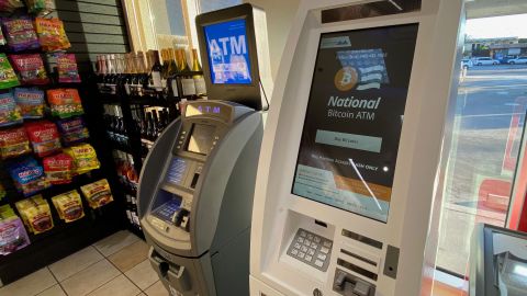 A Bitcoin ATM is seen next to a regular dollar ATM inside a gas station in Los Angeles, California on June 24, 2021. (Photo by Chris Delmas / AFP) (Photo by CHRIS DELMAS/AFP via Getty Images)