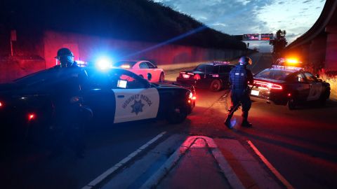 OAKLAND, CALIFORNIA - MAY 29: California Highway Patrol officers block a freeway entrance during a protest sparked by the death of George Floyd while in police custody on May 29, 2020 in Oakland, California. Earlier today, former Minneapolis police officer Derek Chauvin was taken into custody for Floyd's death. Chauvin has been accused of kneeling on Floyd's neck as he pleaded with him about not being able to breathe. Floyd was pronounced dead a short while later. Chauvin and 3 other officers, who were involved in the arrest, were fired from the police department after a video of the arrest was circulated. (Photo by Justin Sullivan/Getty Images)