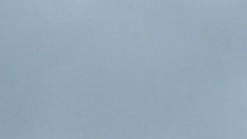 A storm cloud hovers over Los Angeles, California on December 13, 2021. - A storm which has already hit Northern California makes its way south and is expected to bring heavy rain and snow to the mountains of Southern California, raising concern of midslides in fire-ravaged areas. (Photo by Frederic J. BROWN / AFP) (Photo by FREDERIC J. BROWN/AFP via Getty Images)