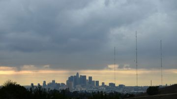 A storm cloud hovers over Los Angeles, California on December 13, 2021. - A storm which has already hit Northern California makes its way south and is expected to bring heavy rain and snow to the mountains of Southern California, raising concern of midslides in fire-ravaged areas. (Photo by Frederic J. BROWN / AFP) (Photo by FREDERIC J. BROWN/AFP via Getty Images)