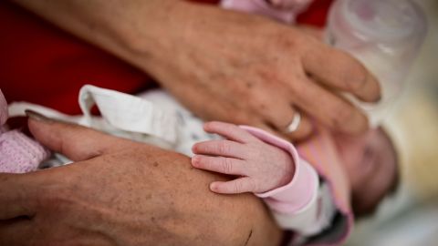 This picture taken on September 13, 2022, shows a nurse feeding newborn baby in the maternity ward in the Gabrovo hospital. - Empty corridors and only eight babies in their cribs. The maternity ward in the city of Gabrovo tells you everything you need to know about the drastic drop in the birth rate in Bulgaria. (Photo by Nikolay DOYCHINOV / AFP) (Photo by NIKOLAY DOYCHINOV/AFP via Getty Images)