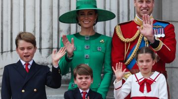 TOPSHOT - (L-R) Britain's Prince George of Wales, Britain's Catherine, Princess of Wales, Britain's Prince Louis of Wales, Britain's Prince William, Prince of Wales and Britain's Princess Charlotte of Wales wave from the balcony of Buckingham Palace after attending the King's Birthday Parade, 'Trooping the Colour', in London on June 17, 2023. The ceremony of Trooping the Colour is believed to have first been performed during the reign of King Charles II. Since 1748, the Trooping of the Colour has marked the official birthday of the British Sovereign. Over 1500 parading soldiers and almost 300 horses take part in the event. (Photo by Adrian DENNIS / AFP) (Photo by ADRIAN DENNIS/AFP via Getty Images)
