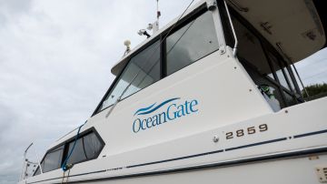 The OceanGate logo is pictured on a boat at the Port of Everett Boat Yard in Everett, Washington, on June 20, 2023. Deep-sea thrill-seeker Stockton Rush founded OceanGate in 2009 with the hopes of advancing submersible vehicle technology and taking travelers into the darkest depths of the ocean. During such a mission on June 18, 2023, the submersible -- with Rush onboard -- went missing, losing contact with the surface ship less than two hours after it began its descent. An international search effort was launched to try and find Rush and the four other passengers in the remote North Atlantic, but no sign of them has been found. (Photo by Jason Redmond / AFP) (Photo by JASON REDMOND/AFP via Getty Images)