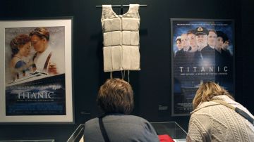 NEW YORK, NY - APRIL 10: A life vest and posters from the 1997 movie "Titanic" hang on display at the opening of the "Titanic at 100: Myth and Memory" exhibition on April 10, 2012 in New York City. The exhibit opened at the Melville Gallery, part of the South Street Seaport Museum, on the 100th anniversary of Titanic's launch on her maiden - and only - voyage. The exhibition features mayday communications from the ship, personal artifacts from survivors, production items from Titanic films and interactive multimedia tours through the ship. The British passenger liner sank in the North Atlantic Ocean, killing more than 1,500 people on April 15,1912 after colliding with an iceberg during her maiden voyage from Southampton, England to New York City. (Photo by John Moore/Getty Images)