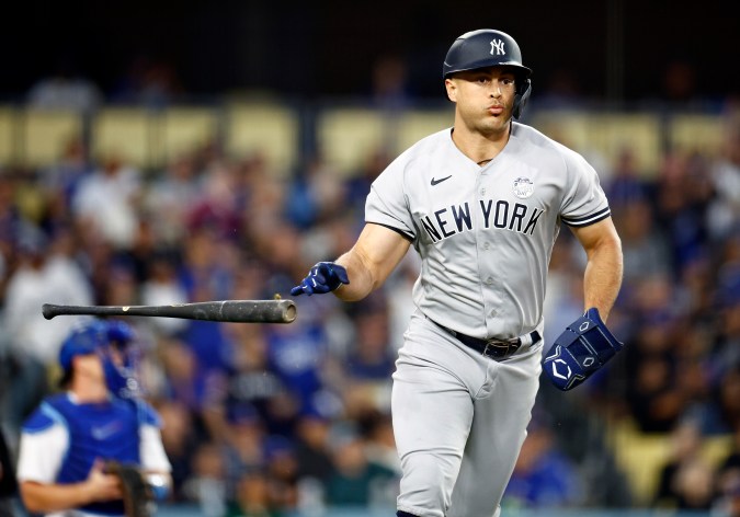 LOS ANGELES, CALIFORNIA - JUNE 02: Giancarlo Stanton #27 of the New York Yankees hits a home run against the Los Angeles Dodgers in the fourth inning at Dodger Stadium on June 02, 2023 in Los Angeles, California. (Photo by Ronald Martinez/Getty Images)