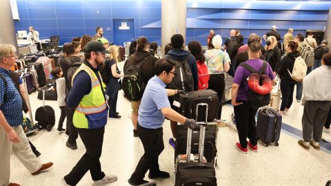 LOS ANGELES, CALIFORNIA - JUNE 29: Travelers await their bags amid rows of unclaimed luggage at the United Airlines baggage claim area at Los Angeles International Airport (LAX) on June 29, 2023 in Los Angeles, California. United Airlines cancelled hundreds of flights again today amid a chaotic week of flight cancellations and delays amid weather issues and strong traveler demand. United Airlines has cancelled nearly 3,000 flights since June 24th as the July 4th holiday travel rush nears. (Photo by Mario Tama/Getty Images)