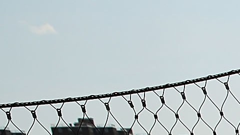 NEW YORK, NY - JUNE 10: A man looks out from the High Bridge, the city's oldest standing bridge, after it recently opened for the first time since it was closed in the early 1970s on June 10, 2015 in New York City. The bridge, which connects Manhattan and the Bronx and spans over the Harlem River, connects 130 acres of parks in the two boroughs. The bridge opened as part of an aqueduct in the mid-1800s to carry water from the Croton River to upper Manhattan which was running short of water at the time. A walkway was added in 1864. Restorations of the 123-foot tall bridge began in 2012 by the Park Department and cost over $60 million. (Photo by Spencer Platt/Getty Images)