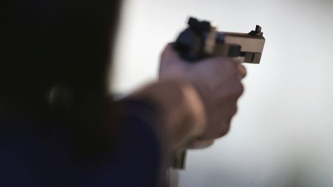 ATHENS - AUGUST 18: Michiko Fukushima of Japan lines up a shot during the women's 25 metre pistol qualifying event on August 18, 2004 during the Athens 2004 Summer Olympic Games at the Markopoulo Olympic Shooting Centre in Athens, Greece. (Photo by Robert Laberge/Getty Images)