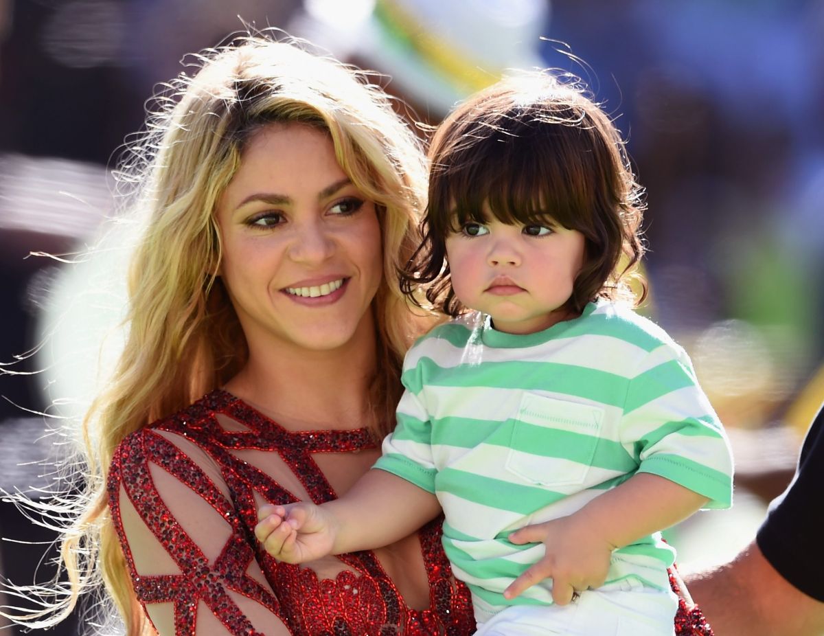 Shakira and her son with Gerard Pique, Milan, at the 2014 FIFA World Cup in Brazil.