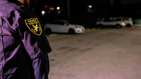 A security member stands in the Safe Parking LA parking lot near the Veteran's Affairs Los Angeles Healthcare Center in Los Angeles, California, February 11, 2019. - Half a dozen such "safe parking" lots monitored by security guards have sprung up in the Los Angeles area in the last year, offering a temporary 12-hour safe haven for some of the estimated 9,000 people across the city who live in their cars or RVs. One is located at the back of a church, another at a synagogue and a third at the Veterans Affairs campus. Portable toilets and hand-washing stations are available to the vehicle dwellers who must fill out an application before being allowed access to the lots. (Photo by Kyle Grillot / AFP) (Photo credit should read KYLE GRILLOT/AFP via Getty Images)