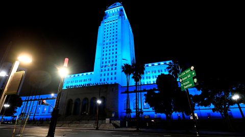 LOS ANGELES, - APRIL 16: A view of Los Angeles City Hall illuminated in blue on April 16, 2020 in Los Angeles, United States. Landmarks and buildings across the nation are displaying blue lights to show support for health care workers and first responders on the front lines of the COVID-19 pandemic. (Photo by Frazer Harrison/Getty Images)