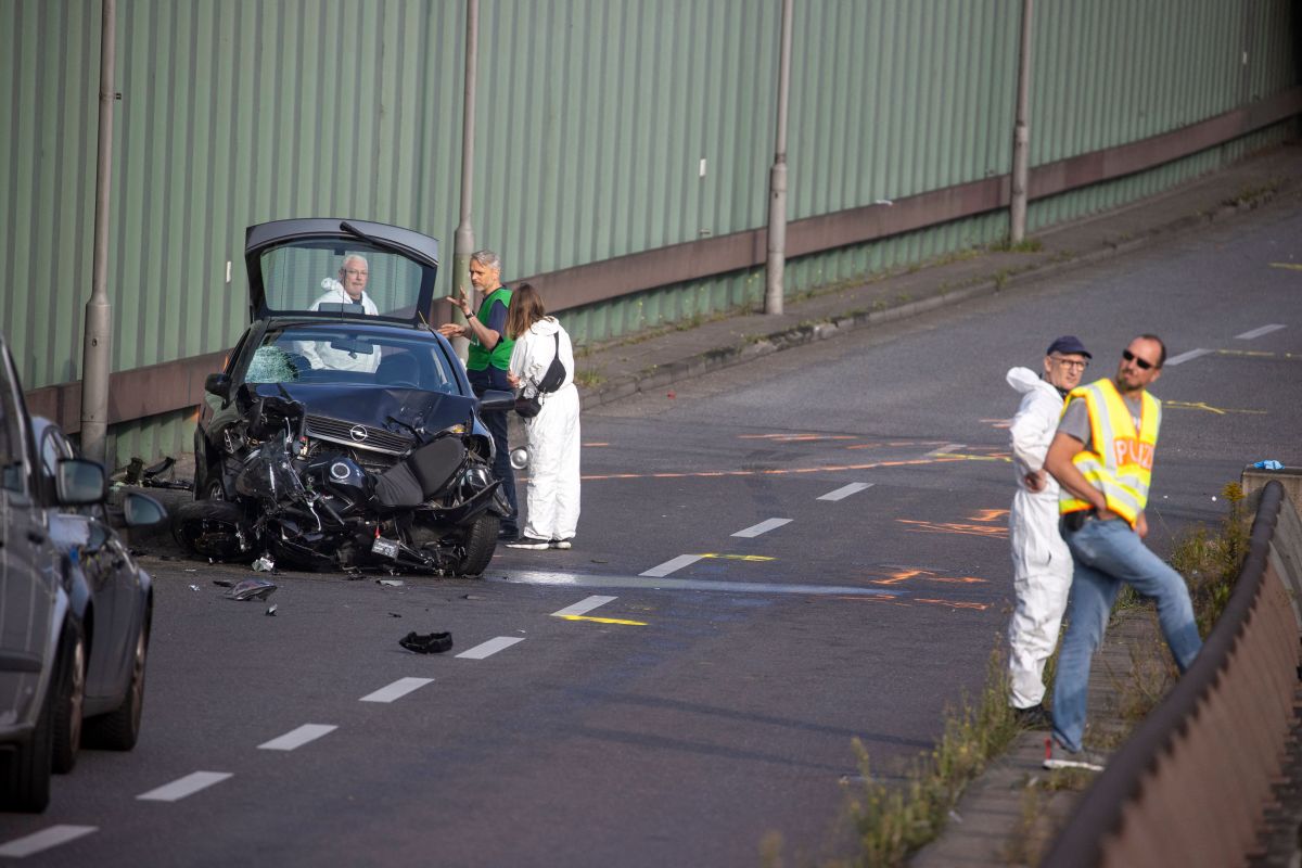 Police officers and forensic experts secure evidences at the site where a motorcycle crashed with a car, probably the car used by an alleged offender to cause several accidents on the A 100 highway in Berlin on August 19, 2020. - A man caused a series of motorway accidents in Berlin on Tuesday night, injuring six people including three seriously in what German prosecutors have described as an Islamist act.  (Photo by Odd ANDERSEN / AFP) (Photo by ODD ANDERSEN/AFP via Getty Images)