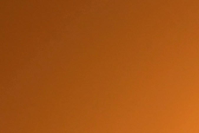 People step into their vehicles as the sun sets over Los Angeles, California on September 30, 2020. - A heat advisory is in effect through Friday in the Southern California region where temperatures are expected to climb into triple-digits, according to the National Weather Service. (Photo by Frederic J. BROWN / AFP) (Photo by FREDERIC J. BROWN/AFP via Getty Images)