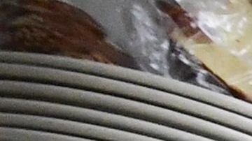 In this photo taken on June 15, 2021 kitchen staff continue wearing facemasks while preparing breakfast at Langer's Delicatessen-Restaurant in Los Angeles, California, on California's first day of fully reopening its economy after some fifteen months of Coronavirus pandemic restrictions. - California state regulators on June 17, 2021 have approved revised workplace pandemic rules ending most mask requirements for employees vaccinated againt the coronavirus. (Photo by Frederic J. BROWN / AFP) (Photo by FREDERIC J. BROWN/AFP via Getty Images)