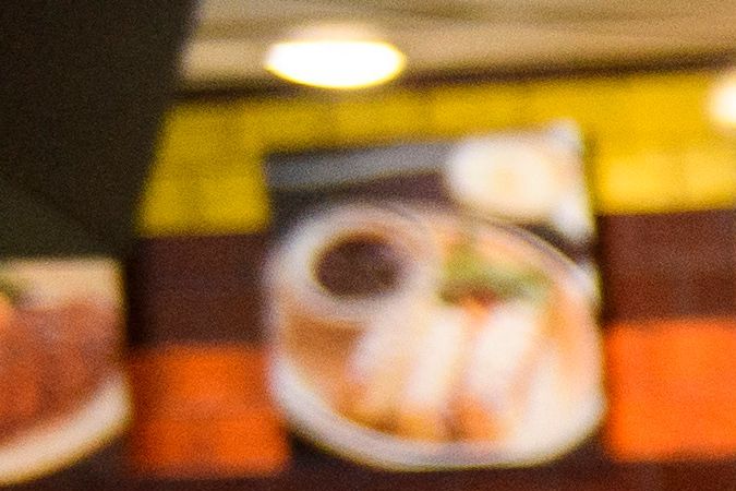 A waiter serves food to customers dining indoors at Langer's Deli in Los Angeles, California on August 7, 2021. - The restaurant announced that proof of vaccination would be required to dine indoors at the restaurant as Covid-19 variant causes surge in the Los Angeles area. (Photo by Patrick T. FALLON / AFP) (Photo by PATRICK T. FALLON/AFP via Getty Images)