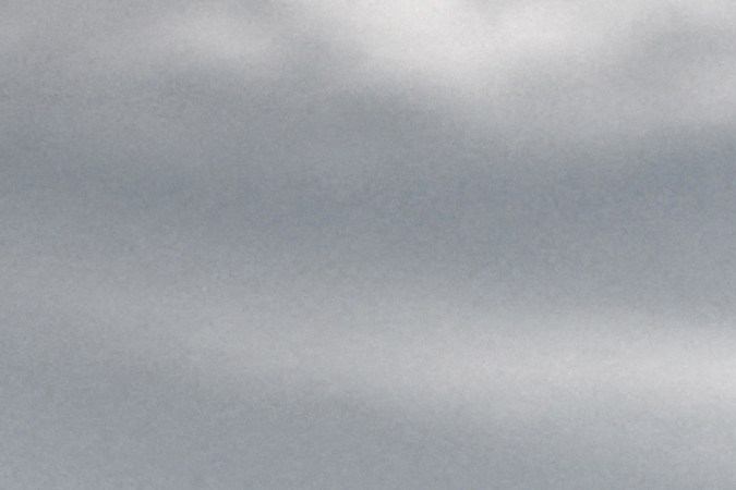 A migrant, picked up at sea while attempting to cross the English Channel, get into a bus to be taken for processing, after disembarking from a UK Border Force boat at the Marina in Dover, on the south-east coast of England, on April 18, 2022. (Photo by Ben Stansall / AFP) (Photo by BEN STANSALL/AFP via Getty Images)