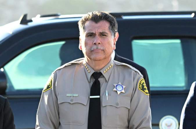 (L-R) Member of the Los Angeles County Board of Supervisors Hilda Solis, Monterey Park mayor Henry Lo, Los Angeles County Sheriff Robert Luna, California's attorney general Rob Bonta and Los Angeles mayor Karen Bass wait for the arrival of US Vice President Kamala Harris at LAX International Airport, on January 25, 2023, in the aftermath of the Monterey Park shooting. - Huu Can Tran, the 72-year-old Asian immigrant who killed 11 people before shooting himself as police moved in on him; was once a regular at the California balroom where the tragic gun massacre unfolded. Tran used a semi-automatic pistol to spray 42 bullets around the studio in Monterey Park, an Asian-majority city near Los Angeles. (Photo by Patrick T. FALLON / AFP) (Photo by PATRICK T. FALLON/AFP via Getty Images)