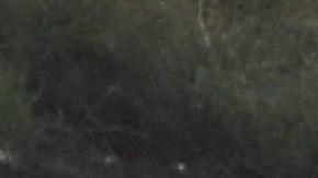 A Los Angeles County Sheriffs Department deputy (C) and California Highway Patrol officer (L) look at a flipped vehicle in the rain on Interstate 5 during a winter storm near Gorman, California, on March 21, 2023. (Photo by Patrick T. Fallon / AFP) (Photo by PATRICK T. FALLON/AFP via Getty Images)