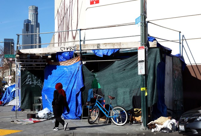 LOS ANGELES, CALIFORNIA - DECEMBER 14: A homeless encampment lines a sidewalk in the Skid Row community on December 14, 2022 in Los Angeles, California. New Los Angeles Mayor Karen Bass declared a state of emergency on her first day in office in an effort to tackle the city’s homelessness crisis where an estimated 40,000 residents are unhoused. The Skid Row community is home to thousands of people who either live on the streets or in shelters. (Photo by Mario Tama/Getty Images)