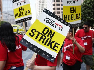 LOS ANGELES, CALIFORNIA - JULY 02: Hotel workers with Unite Here Local 11 picket outside the InterContinental hotel on the first day of a strike by union members at many major hotels in Southern California on July 2, 2023 in Los Angeles, California. The union represents nearly 15,000 workers from 65 major hotels in Los Angeles and Orange Counties who are calling for higher pay and increased benefits. Affected hotels are currently remaining open with management and nonunion staff attempting to fill in during the strike ahead of the 4th of July holiday. (Photo by Mario Tama/Getty Images)