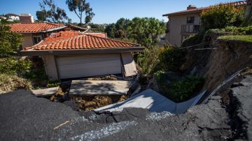 Collapsed homes are pictured as they slid down a hill along a street at the Rolling Hills States neighborhood fall along with it, in Rancho Palos Verdes, California on July 10, 2023. (Photo by Apu GOMES / AFP) (Photo by APU GOMES/AFP via Getty Images)