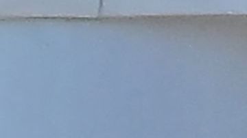 Un hombre se retrata junto a un termómetro que muestra 102 F en Baker, California, el 11 de julio de 2023.