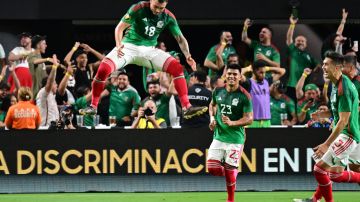 Mexico's midfielder Luis Chavez (L) celebrates scoring his team's second goal during the Concacaf 2023 Gold Cup semifinal football match between Mexico and Jamaica at Allegiant Stadium in Las Vegas, Nevada on July 12, 2023. (Photo by Frederic J. BROWN / AFP) (Photo by FREDERIC J. BROWN/AFP via Getty Images)