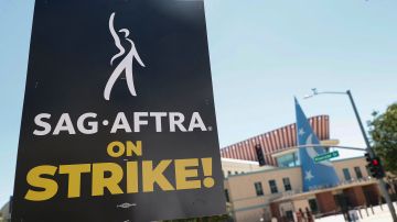 A strike sign is seen in front of Disney Feature Animation Building as members of the Writers Guild of America and the Screen Actors Guild walk a picket line outside Disney Studios in Burbank, California, on July 14, 2023. Tens of thousands of Hollywood actors went on strike at midnight July 13, 2023, effectively bringing the giant movie and television business to a halt as they join writers in the first industry-wide walkout for 63 years. (Photo by Michael Tran / AFP) (Photo by MICHAEL TRAN/AFP via Getty Images)