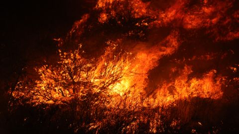 TOPSHOT - Flames from the Rabbit Fire that scorched over 7,500 acres are raging in Moreno Valley, Riverside County, California on July 15, 2023. Brutally high temperatures threatened tens of millions of Americans July 15, as numerous cities braced to break records under a relentless heat dome that has baked parts of the country all week. The National Weather Service warned of an "extremely hot and dangerous weekend," with daytime highs reaching up to 116 Fahrenheit (47 degres celsius). (Photo by DAVID SWANSON / AFP) (Photo by DAVID SWANSON/AFP via Getty Images)