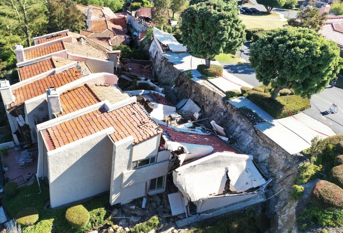 ROLLING HILLS ESTATES, CALIFORNIA - JULY 11: An aerial view of upscale homes destroyed by a landslide on Palos Verdes Peninsula on July 11, 2023 in Rolling Hills Estates, California. The still unexplained landslide destroyed 12 homes over the weekend and has sent ten of the homes slowly sliding toward a canyon below, forcing the City Council to declare a local state of emergency. (Photo by Mario Tama/Getty Images)