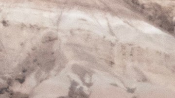 FURNACE CREEK, CALIFORNIA - JULY 16: U.S. Park Ranger Eric Henson (R) pretends to be cold while posing next to the unofficial thermometer at the Furnace Creek Visitor Center indicating a temperature of 132 degrees Fahrenheit, which is known for showing temperatures that are inaccurately higher than the official temperature, on a day that could set a new world heat record in Death Valley National Park on July 16, 2023 near Furnace Creek, California. Weather forecasts for tomorrow call for a high temperature of 129 degrees F and possibly as high as 131. Previously, the highest temperature reliably recorded on Earth was 129.2 F (54C) in Death Valley in 2013. A century earlier, a high temperature in Death Valley reportedly reached 134 F but many modern weather experts have rejected that claim along with other high summer temperatures reported in the region that year. (Photo by David McNew/Getty Images)