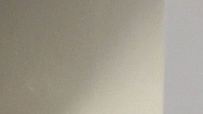 LOS ANGELES, CALIFORNIA - JULY 20: A person poses for a photo beneath an enlarged symbolic check for $1.08 billion in Las Palmitas Mini Market on July 20, 2023 in Los Angeles, California. The $1.08 billion winning Powerball ticket was sold at the Las Palmitas Mini Market for the July 19th drawing. The jackpot is the third largest in Powerball history and was picked after three months of drawings without a winner. The mini market is located in the downtown Fashion District close to Skid Row. (Photo by Mario Tama/Getty Images)