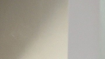 LOS ANGELES, CALIFORNIA - JULY 20: A person poses for a photo beneath an enlarged symbolic check for $1.08 billion in Las Palmitas Mini Market on July 20, 2023 in Los Angeles, California. The $1.08 billion winning Powerball ticket was sold at the Las Palmitas Mini Market for the July 19th drawing. The jackpot is the third largest in Powerball history and was picked after three months of drawings without a winner. The mini market is located in the downtown Fashion District close to Skid Row. (Photo by Mario Tama/Getty Images)