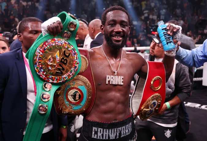 LAS VEGAS, NEVADA - JULY 29: Terence Crawford celebrates with the championship belt after defeating Errol Spence Jr. in the World Welterweight Championship bout at T-Mobile Arena on July 29, 2023 in Las Vegas, Nevada. (Photo by Al Bello/Getty Images)