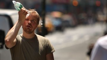NEW YORK - JUNE 9: A man tries to cool himself with a bottle of water during the first heat wave of the year June 9, 2008 in New York City. According to the National Weather Service temperatures will near 100 degrees today in the New York metro area with no relief in sight until Wednesday, June 11. (Photo by Spencer Platt/Getty Images)