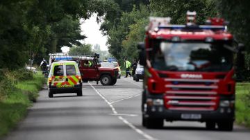 Emergency vehicles fill the road at the scene of an in-air collision between a Cessna 402 twin-engined aeroplane and possibly a micro-light style aircraft close to Coombe Abbey near Coventry on August 17, 2008. Five people are confirmed to have been killed in the incident with an eye-witness suggesting that the smaller aircraft flew into the side of the larger Cessna as it came into land at Coventry airport. AFP PHOTO/Leon Neal (Photo credit should read Leon Neal/AFP via Getty Images)