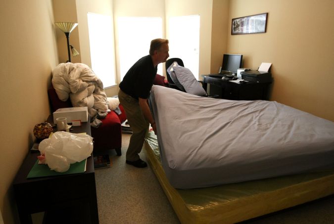 SAN FRANCISCO - APRIL 30: Pestec technician Darrell Azlin moves a bed in an apartment with bed bugs April 30, 2009 in San Francisco, California. Cases of bed bug infestations are on the rise across the U.S. with many people bringing them into their homes after visiting hotels and airports. Bed bugs feed off of human blood. (Photo by Justin Sullivan/Getty Images)