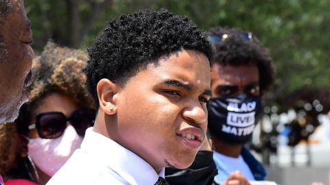 Jamal Shakir (C) speaks at a press conference in front of Los Angeles Police Department headquarters in Los Angeles, California on May 11, 2021. - 23-year-old Jamal Shakir is suing the city of Los Angeles and his uncle, a LAPD officer, alleging he ordered his nephew be shot with projectiles during a protest following the death of George Floyd. (Photo by Frederic J. BROWN / AFP) (Photo by FREDERIC J. BROWN/AFP via Getty Images)