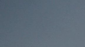 Transit passengers wear face masks as they wait to board the Metro C Line, formerly Green Line, light rail train alongside the 105 Freeway at the Judge Harry Pregerson Interchange during rush hour traffic in Los Angeles, California on July 16, 2021. - The Metro C Line will eventually merge with the Crenshaw/LAX Transit Project as infrastructure modernization and transit construction projects continue at the airport ahead of the 2028 Los Angeles Olympics to reduce carbon emissions, traffic, and their impact towards climate change. (Photo by Patrick T. FALLON / AFP) (Photo by PATRICK T. FALLON/AFP via Getty Images)