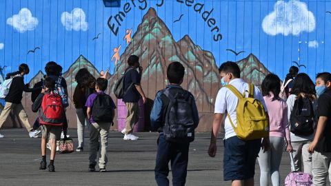 Students walk to their classrooms at a public middle school in Los Angeles, California, September 10, 2021. - Children aged 12 or over who attend public schools in Los Angeles will have to be fully vaccinated against Covid-19 by the start of next year, city education chiefs said September 9, 2021, the first such requirement by a major education board in the United States. (Photo by Robyn Beck / AFP) (Photo by ROBYN BECK/AFP via Getty Images)