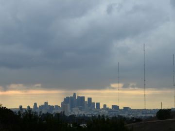 A storm cloud hovers over Los Angeles, California on December 13, 2021. - A storm which has already hit Northern California makes its way south and is expected to bring heavy rain and snow to the mountains of Southern California, raising concern of midslides in fire-ravaged areas. (Photo by Frederic J. BROWN / AFP) (Photo by FREDERIC J. BROWN/AFP via Getty Images)